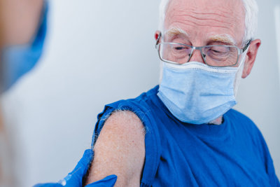 Old man getting vaccine