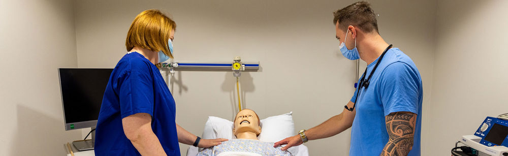 Healthcare Workers With Dummy