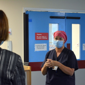 Woman speaking to nurse