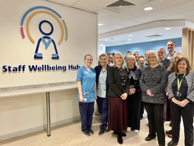 A group photograph of NHS Fife Staff and Fife Health Charity Trustees celebrating the opening of the new Staff Wellbeing Hub at Victoria Hospital, Kirkcaldy.