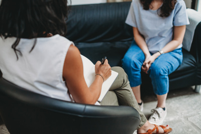 therapist sitting with patient