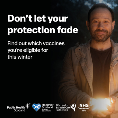Man holding a light as part of a the winter vaccination campaign