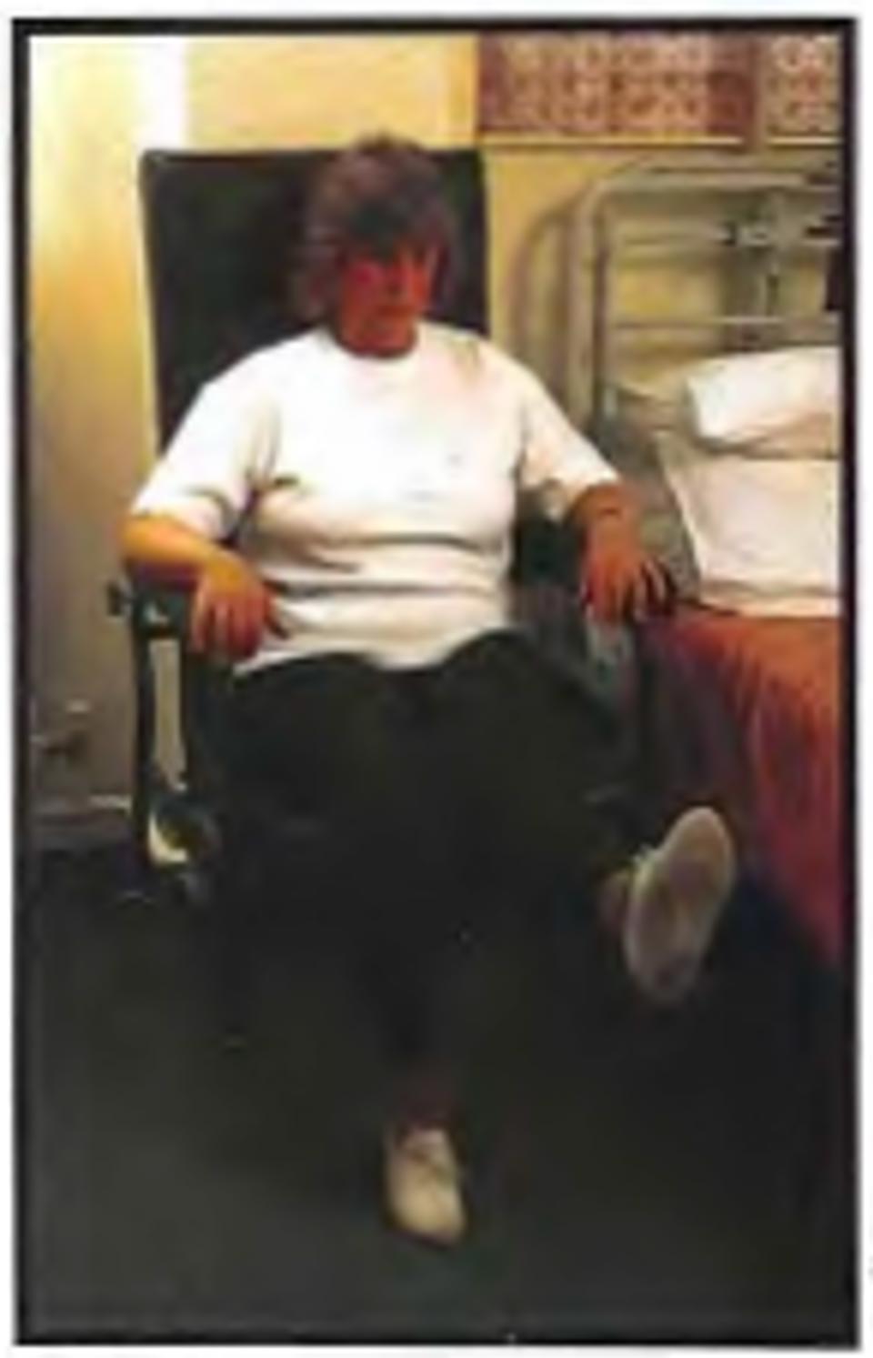 woman sitting down straightening knee