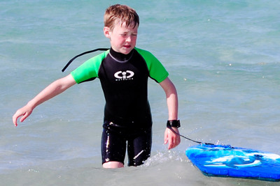 Child surfing in the sea