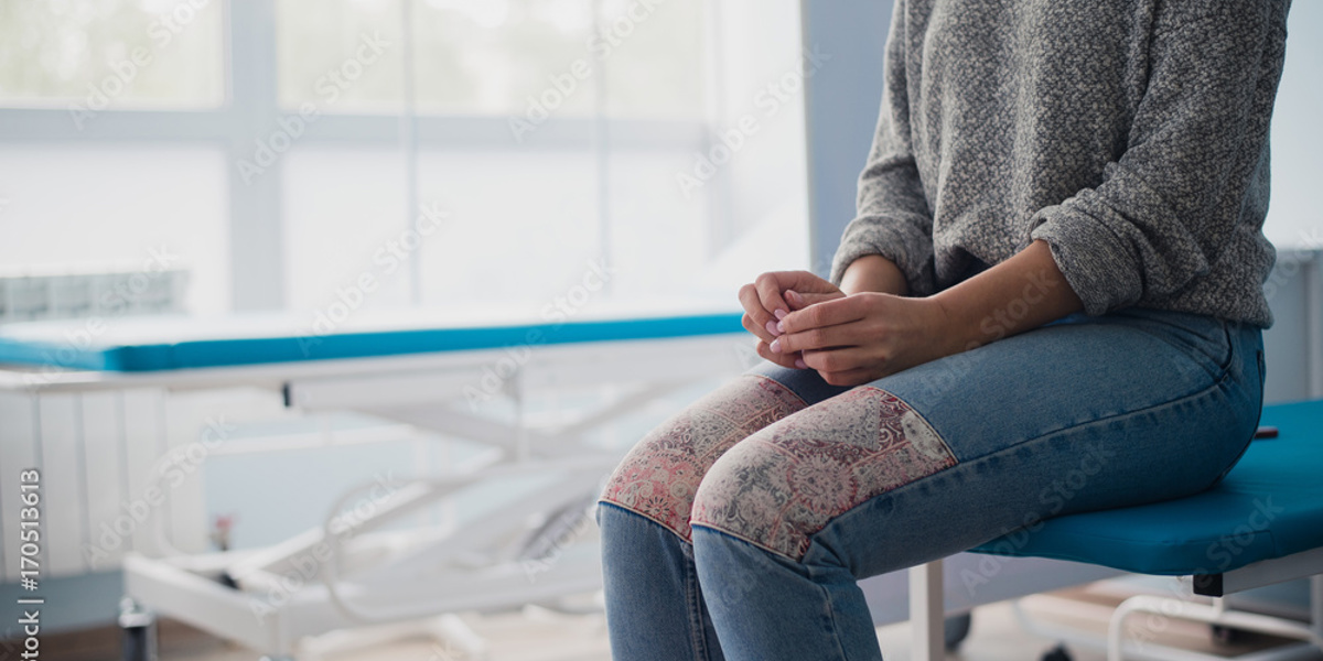 woman sitting waiting nervously
