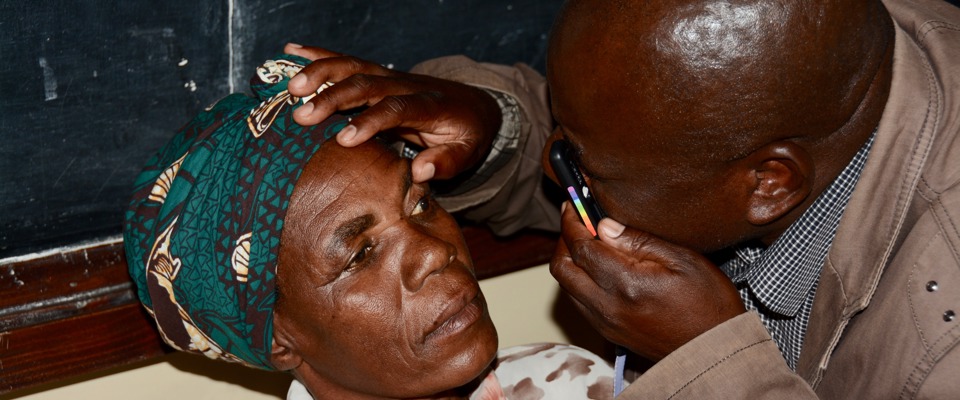 Doctor examines a patient's eyes