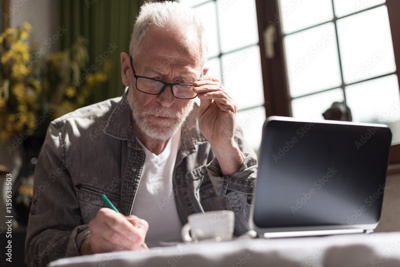 man sitting at laptop