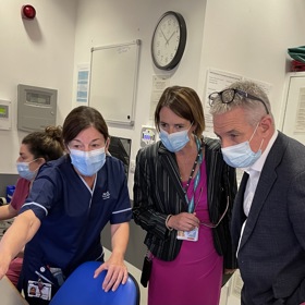 Nurse pointing to computer with director or RCN