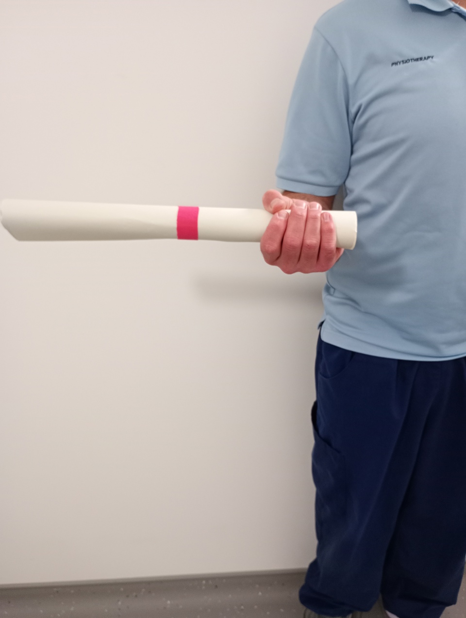 Man Holding Rolled Up Paper