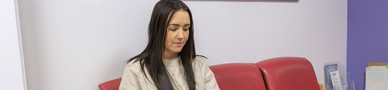 Female Patient In Waiting Room