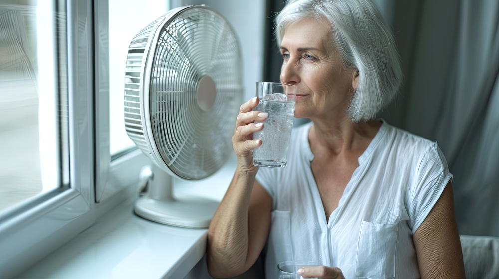 Woman Drinking And Keeping Cool