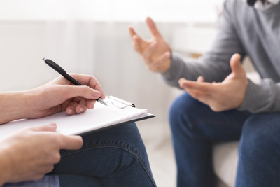 therapist discussing with patient