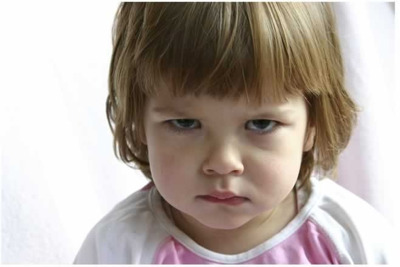 girl toddler angry face