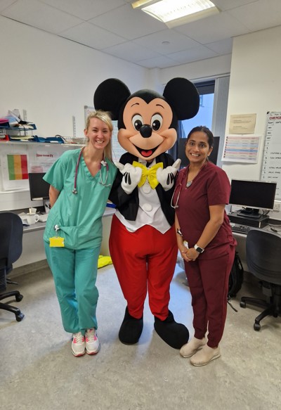 Mickey mouse with staff members