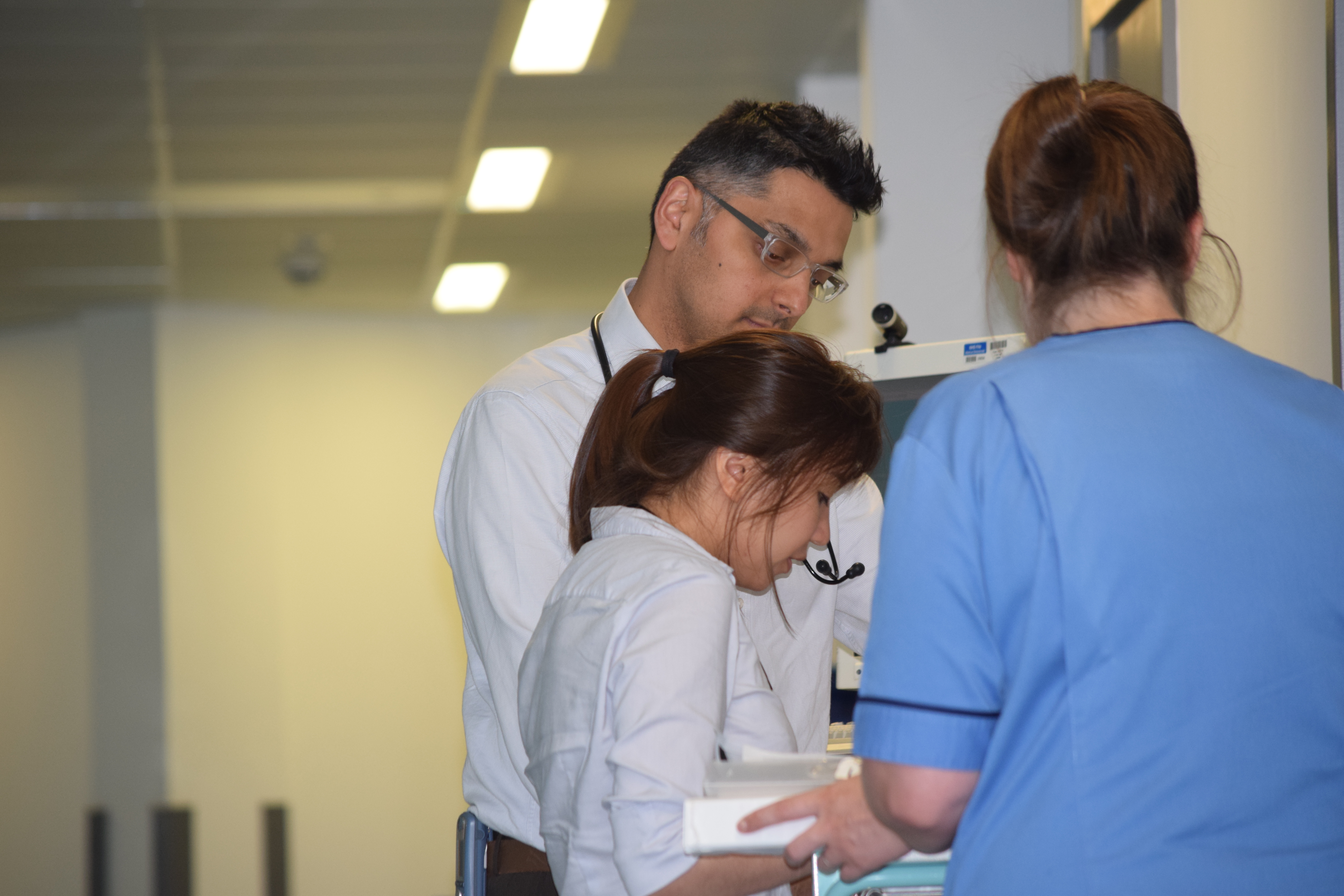 doctor and nurses speaking