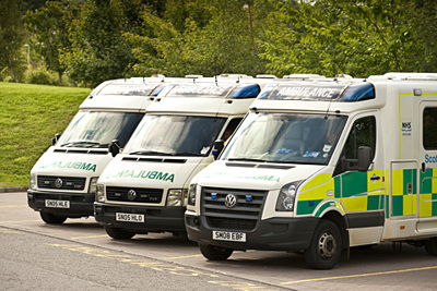 Three ambulances parked