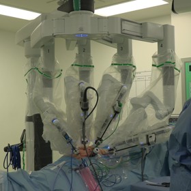Robot operating on patient