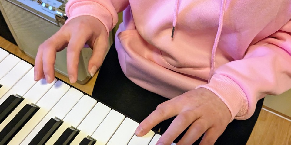 Patient playing a keyboard.