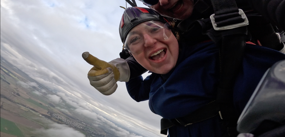 Elana Parachuting Thumbs Up