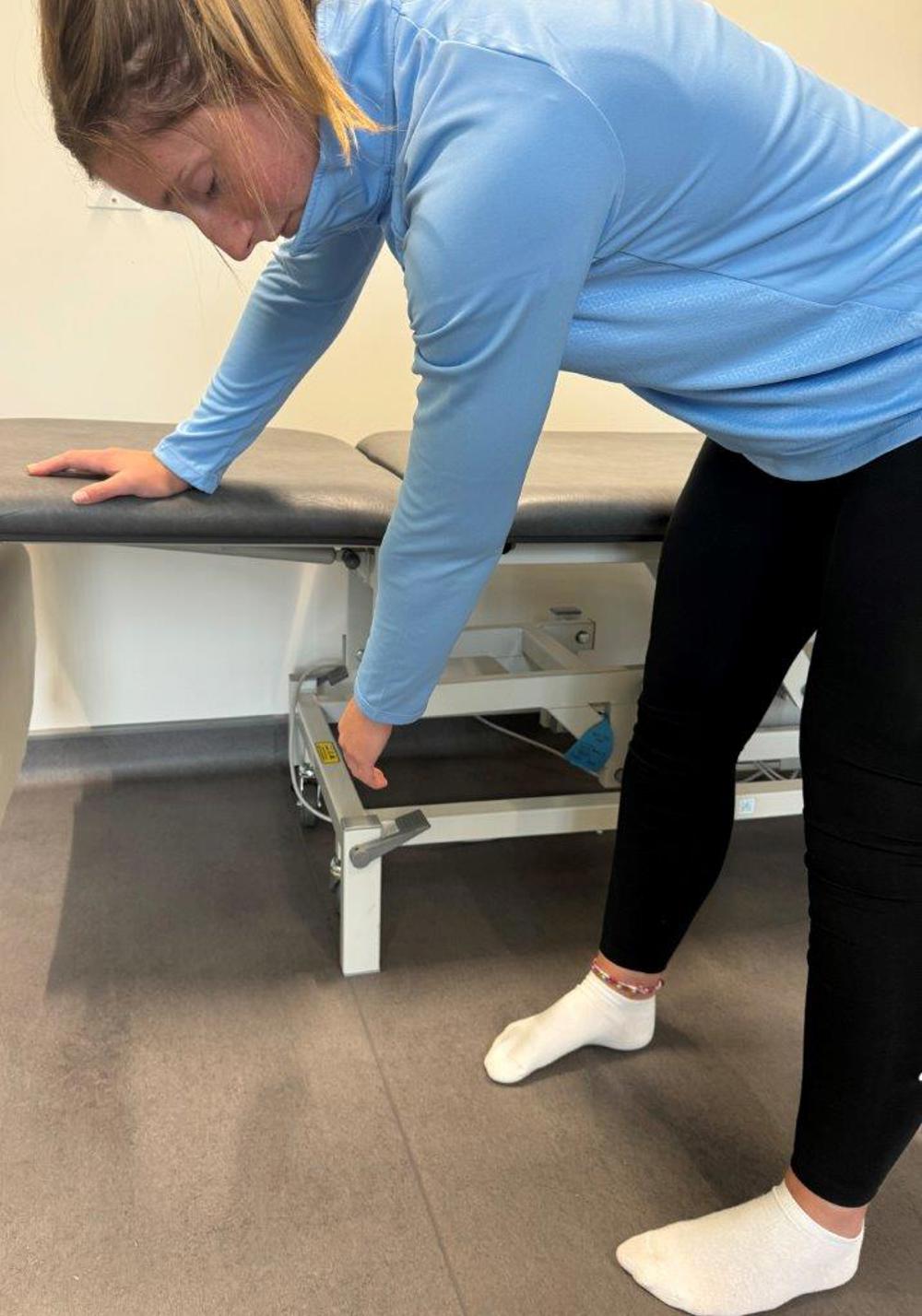 Woman Supporting Arm On Trolley And Letting Other Arm Hang