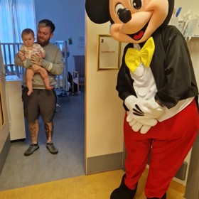 Mickey mouse in  ward  with family