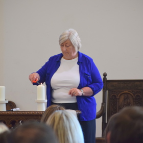 Intensive care nurses lighting a candle at the organ donation memorial event