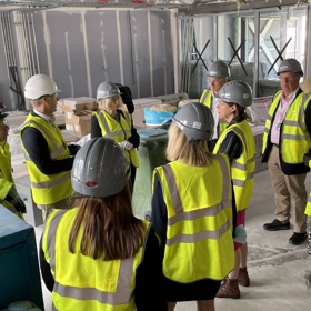 Group of people in Hi vis vests and safety helmets