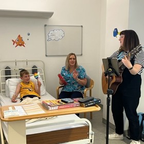 Singing to a child in ward