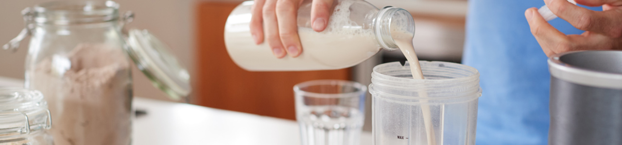 milk pouring into shake mixer