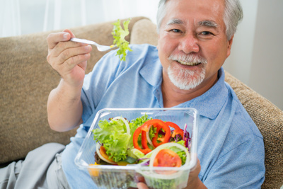 happy man With Salad Box