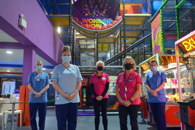 Group of nurses at softplay with facemasks