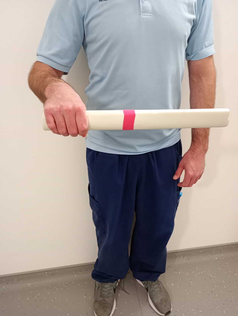 Man Holding Rolled Up Paper 2