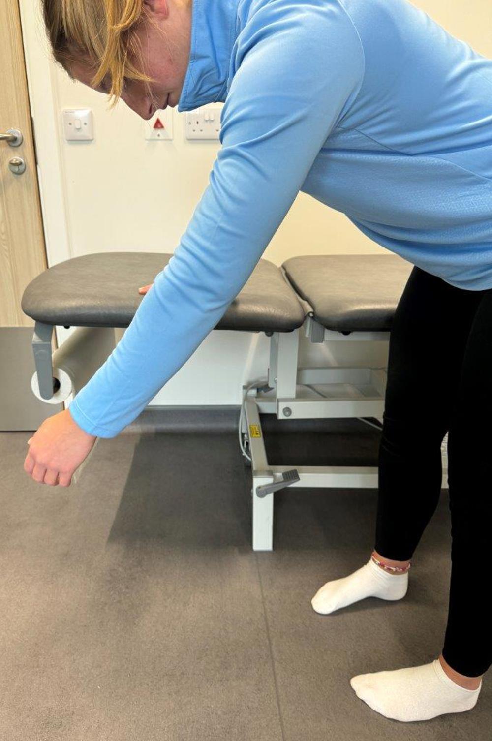 Woman Bent With Arm Hanging Like A Pendulum