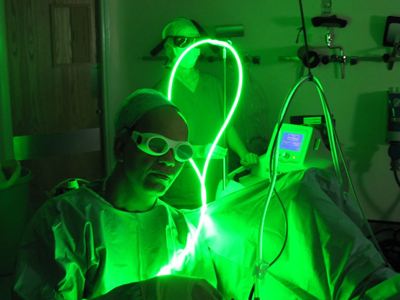 theatre staff wearing goggles under green light