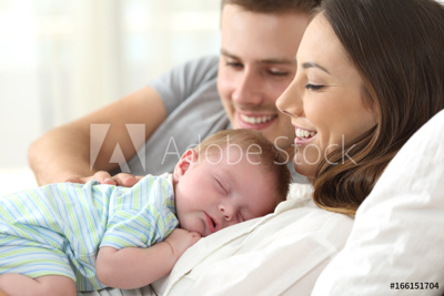  couple holding their newborn baby