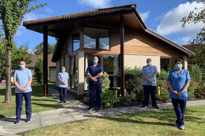 Care Home Imms Team pictured outside wearing masks