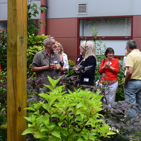 People gathering at Queen Margaret Hospital garden