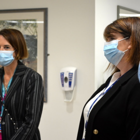woman wearing facemasks talking